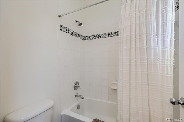 bathroom with shower / tub combo with curtain and toilet