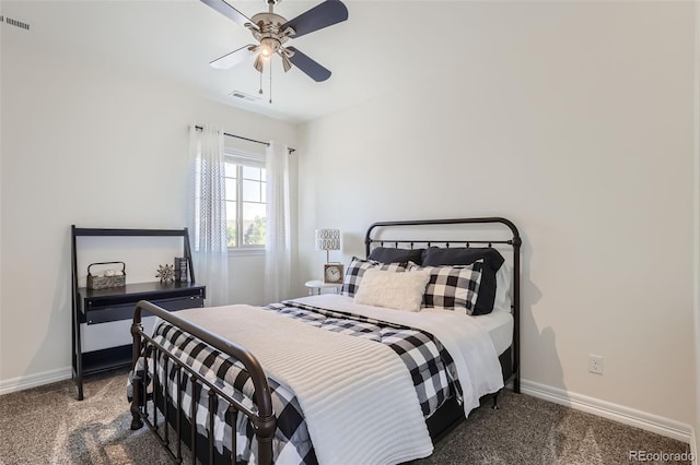 bedroom with ceiling fan and dark colored carpet