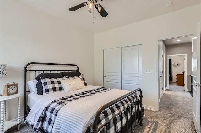 bedroom with a closet, ceiling fan, and carpet