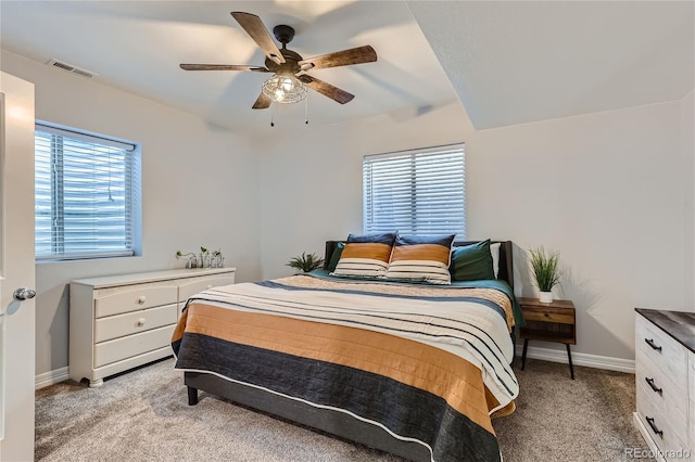 bedroom featuring light carpet and ceiling fan