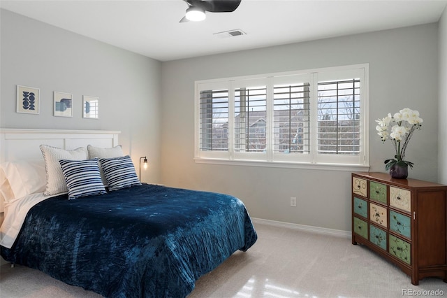 bedroom with visible vents, carpet floors, baseboards, and ceiling fan