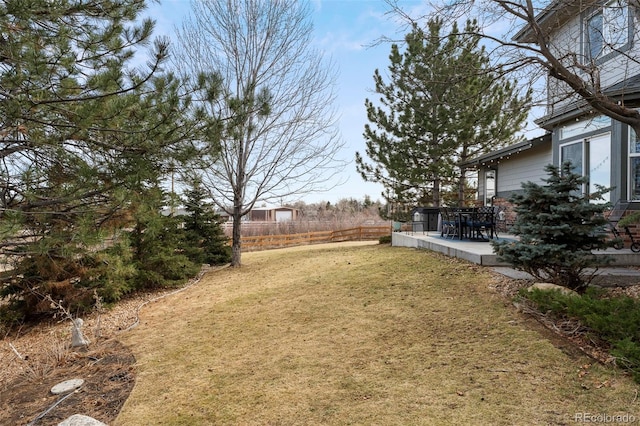 view of yard featuring a patio area and fence