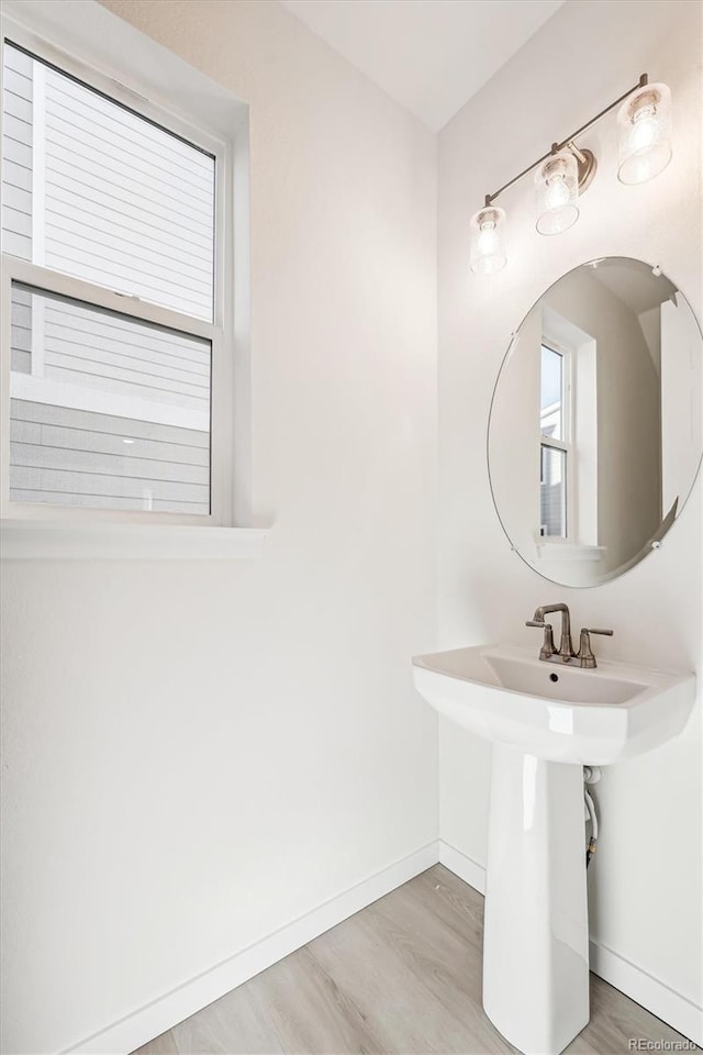 bathroom with wood-type flooring and sink