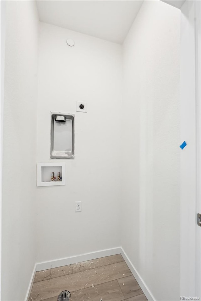 laundry room with hookup for an electric dryer, hookup for a washing machine, and hardwood / wood-style flooring