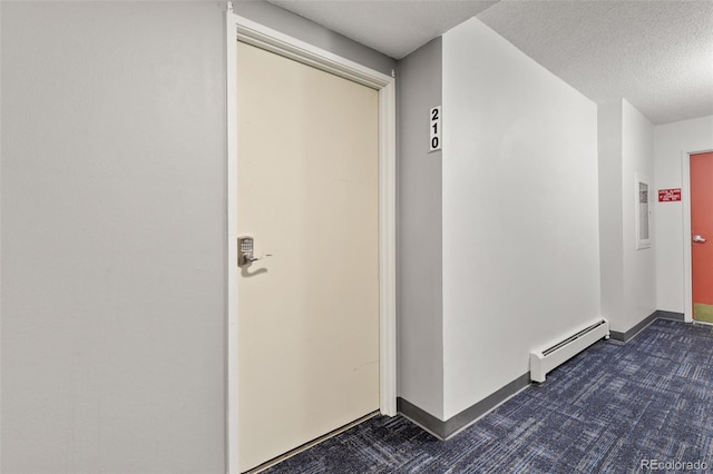 doorway to property featuring a baseboard heating unit