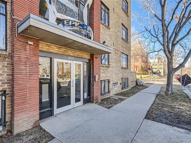 500 E 11th Ave Unit 203, Denver, CO 80203 - doorway to property with french doors and brick siding