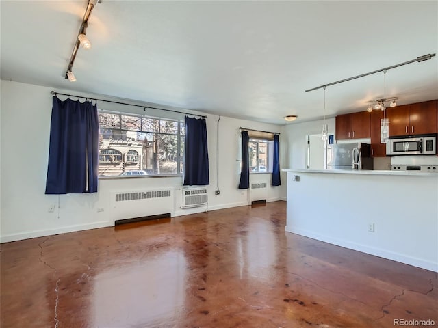 500 E 11th Ave Unit 203, Denver, CO 80203 - unfurnished living room with radiator, finished concrete flooring, and track lighting