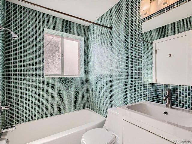 500 E 11th Ave Unit 203, Denver, CO 80203 - bathroom featuring tile walls, shower / washtub combination, and vanity