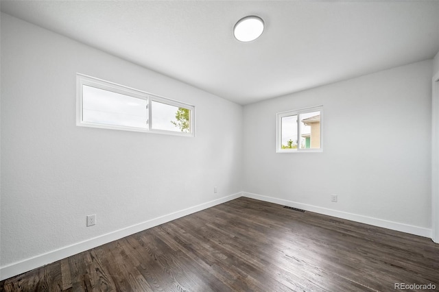 4640 W Ellsworth Ave, Denver, CO 80219 - empty room with plenty of natural light and baseboards