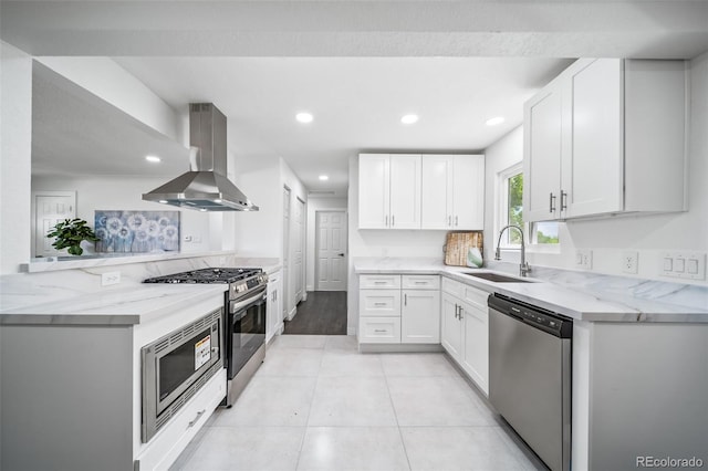 4640 W Ellsworth Ave, Denver, CO 80219 - kitchen with a sink, island exhaust hood, appliances with stainless steel finishes, light stone countertops, and white cabinets