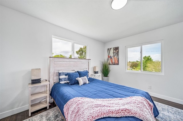 4640 W Ellsworth Ave, Denver, CO 80219 - bedroom with baseboards and wood finished floors