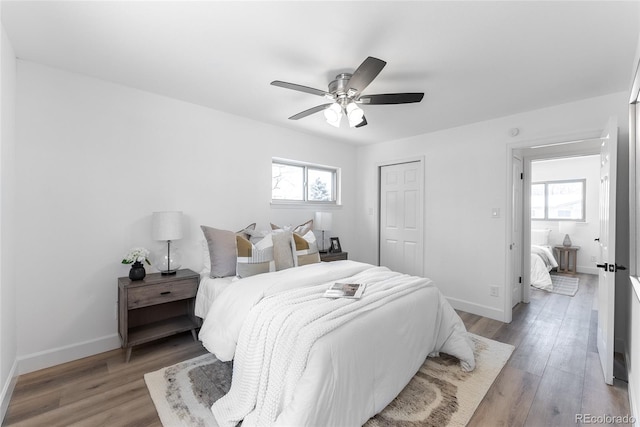 bedroom featuring ceiling fan and light hardwood / wood-style flooring