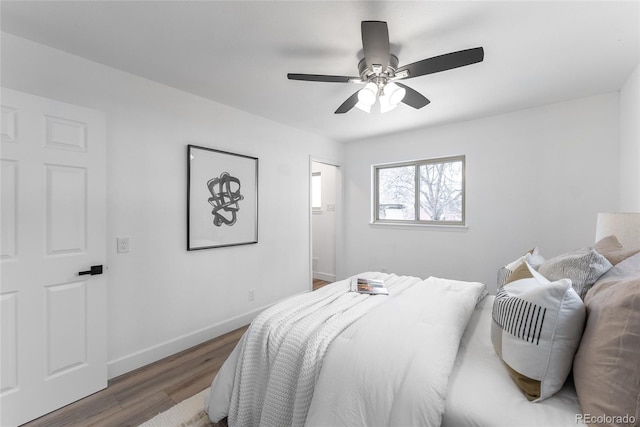 bedroom featuring ceiling fan and dark hardwood / wood-style floors