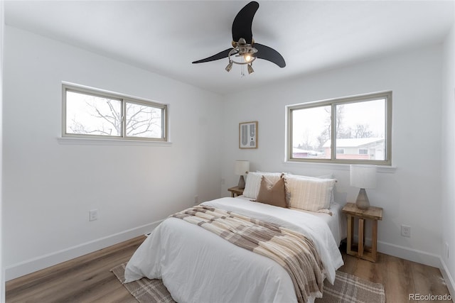 bedroom featuring hardwood / wood-style flooring and ceiling fan