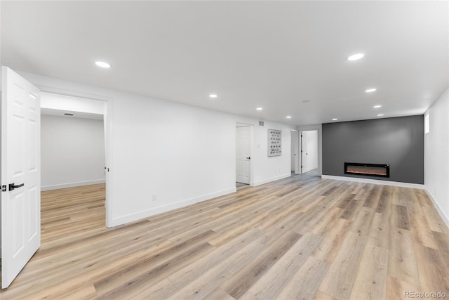 unfurnished living room featuring light hardwood / wood-style floors