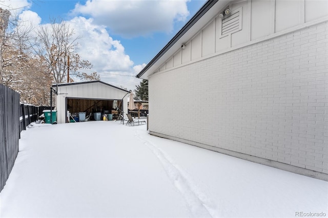 exterior space featuring a garage and an outdoor structure