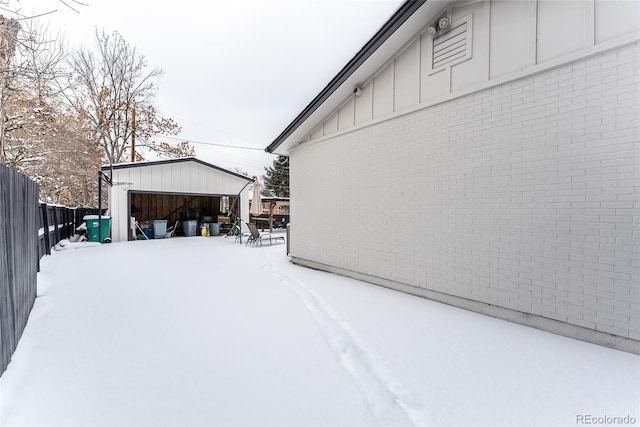 exterior space with a garage and an outbuilding