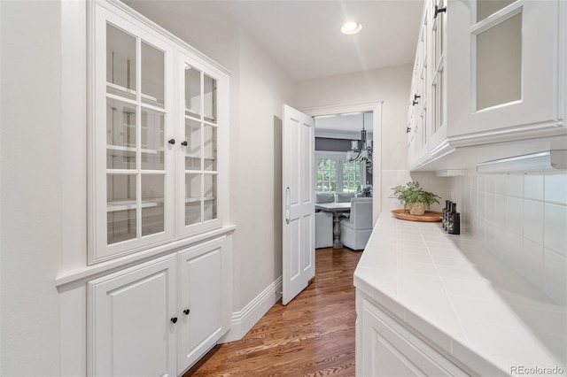 7 Mockingbird Ln, Cherry Hills Village, CO 80113 - hall featuring wood finished floors and recessed lighting