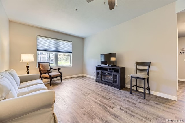 12818 Ironstone Way Unit 101, Parker, CO 80134 - living room with wood finished floors, baseboards, and a ceiling fan