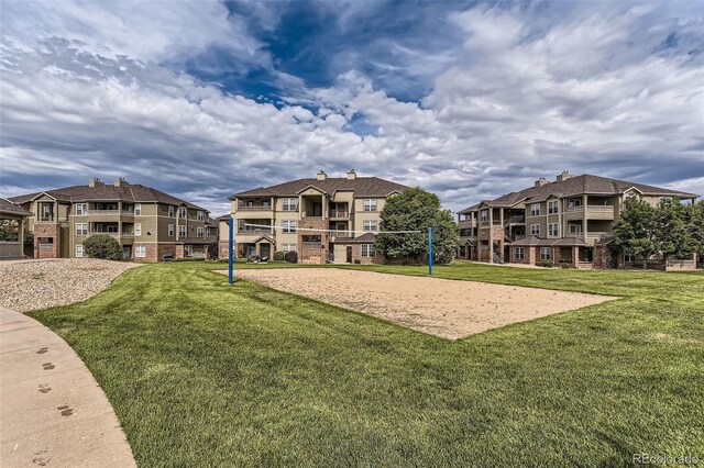 12818 Ironstone Way Unit 101, Parker, CO 80134 - view of home's community with volleyball court, a lawn, and a residential view