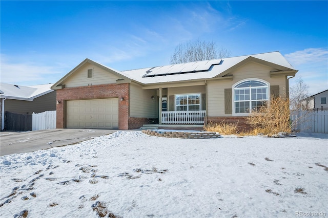 single story home featuring brick siding, driveway, an attached garage, and fence