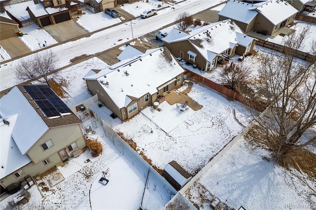 snowy aerial view featuring a residential view