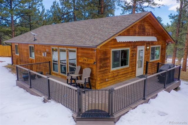 view of snow covered house