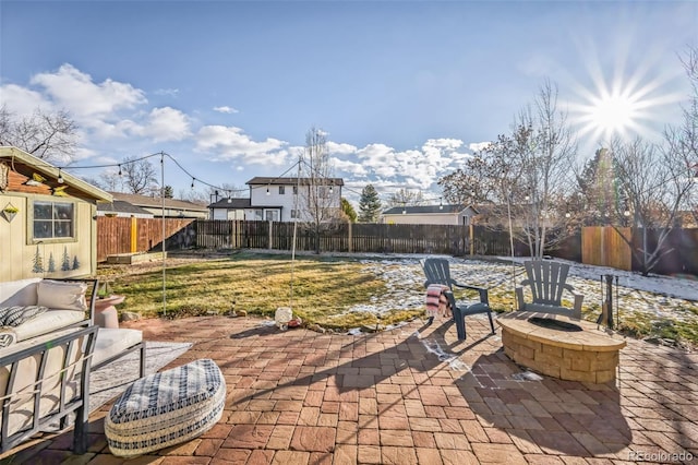 view of patio / terrace featuring an outdoor fire pit