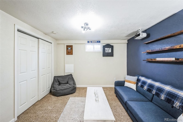 living area with a textured ceiling and light colored carpet