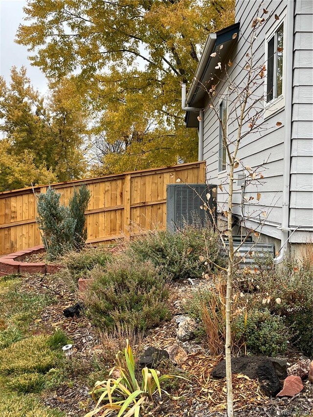 view of yard with central air condition unit