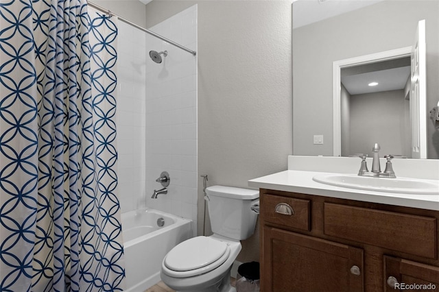 full bathroom featuring toilet, shower / bath combo, and vanity