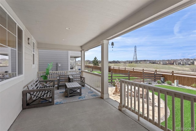 view of patio with fence and an outdoor hangout area