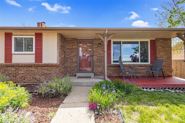 1982 S Truckee St, Aurora, CO 80013 - property entrance with brick siding and a chimney