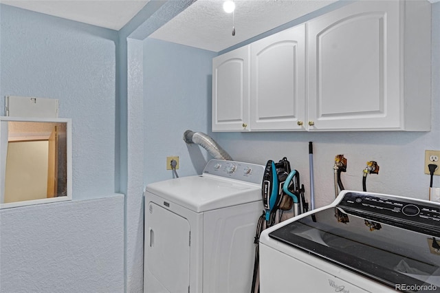 1982 S Truckee St, Aurora, CO 80013 - laundry room with a textured wall, cabinet space, a textured ceiling, and washer and clothes dryer