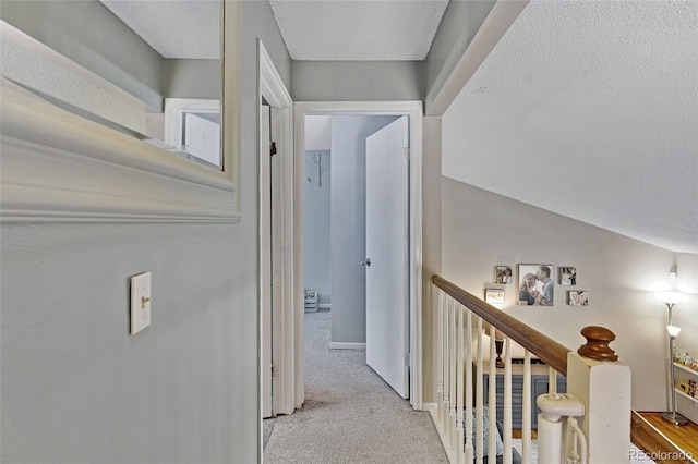 1982 S Truckee St, Aurora, CO 80013 - corridor featuring a textured ceiling, an upstairs landing, and carpet floors