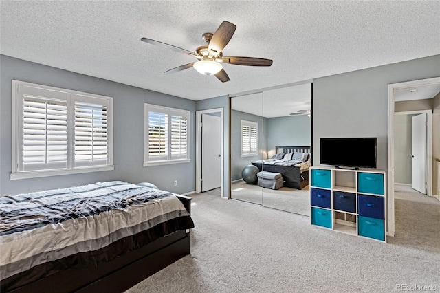 1982 S Truckee St, Aurora, CO 80013 - bedroom with carpet floors, a textured ceiling, a closet, and ceiling fan