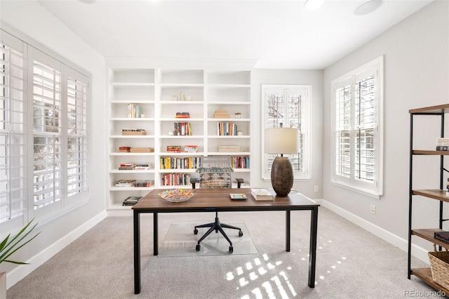 carpeted office with baseboards