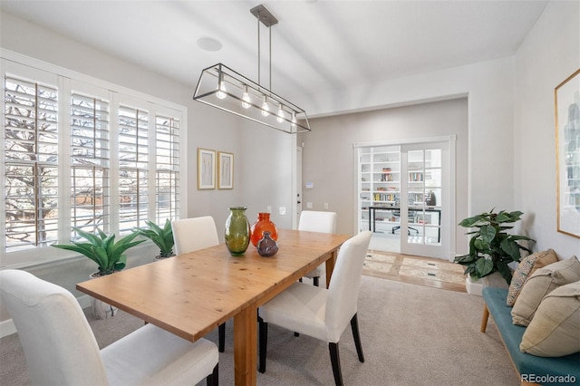 dining space featuring carpet