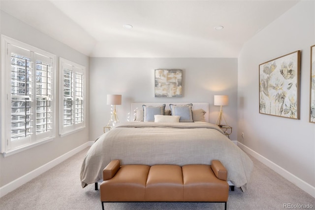 carpeted bedroom with recessed lighting, vaulted ceiling, and baseboards