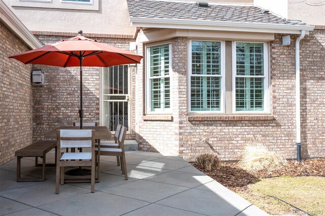 view of patio featuring outdoor dining area