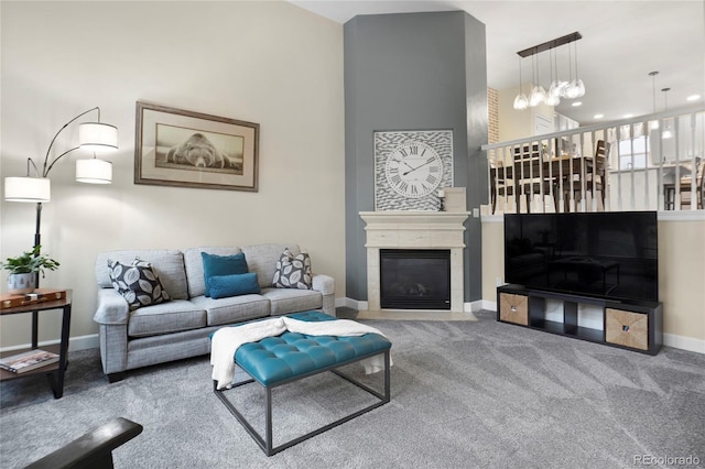 carpeted living room with a tile fireplace