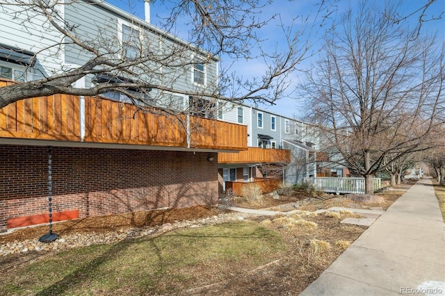 view of side of property with brick siding