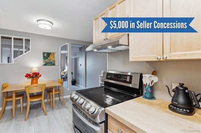 1111 Maxwell Ave Unit 228, Boulder, CO 80304 - kitchen featuring stainless steel range with electric cooktop, under cabinet range hood, light wood-style floors, light brown cabinetry, and light countertops