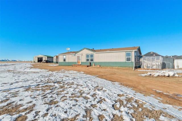 view of snow covered house