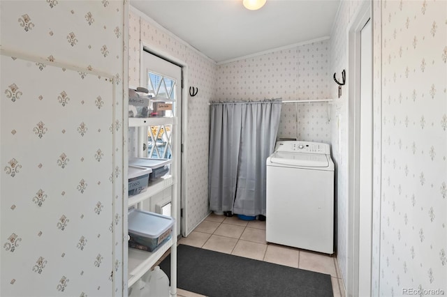 laundry room with light tile patterned floors and washer / clothes dryer