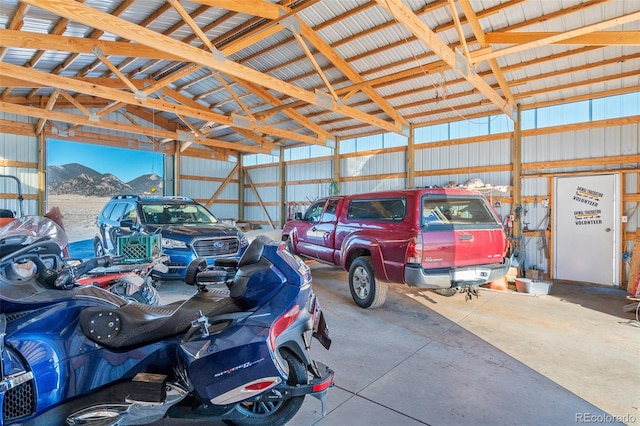 garage featuring metal wall and a mountain view