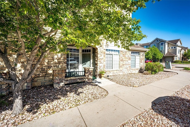 452 Black Feather Loop Unit 608, Castle Rock, CO 80104 - view of front of property with stone siding and a porch