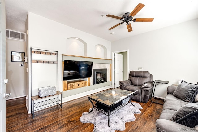 452 Black Feather Loop Unit 608, Castle Rock, CO 80104 - living room featuring a ceiling fan, wood finished floors, a tile fireplace, and baseboards