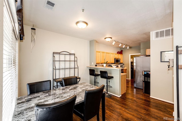 452 Black Feather Loop Unit 608, Castle Rock, CO 80104 - dining area with dark wood-style floors