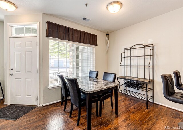 452 Black Feather Loop Unit 608, Castle Rock, CO 80104 - dining space with dark wood-style floors and baseboards